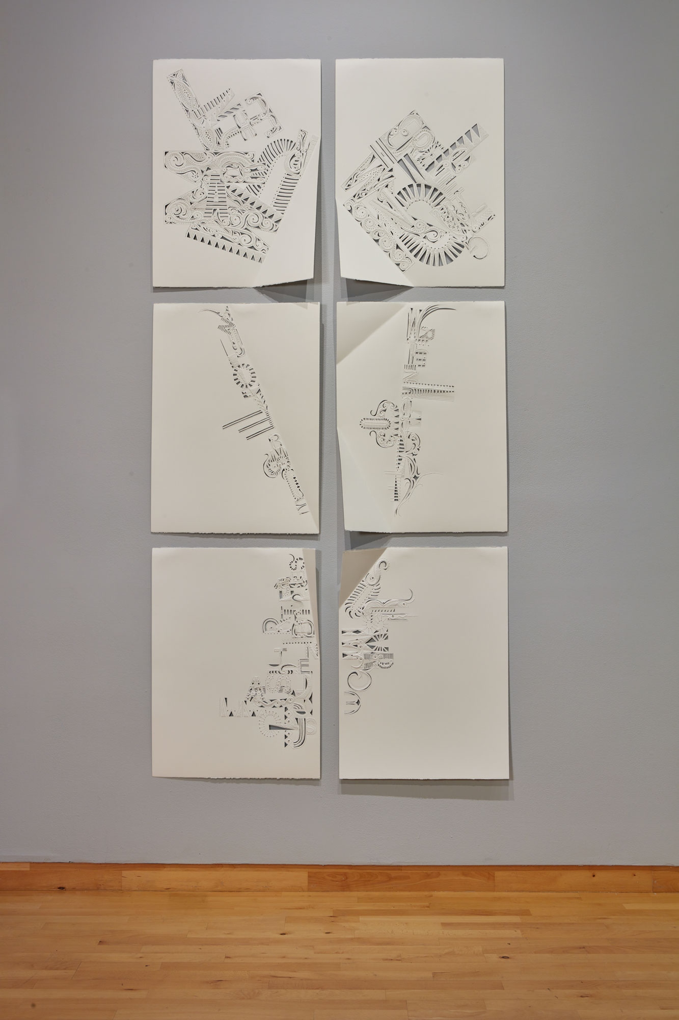 Rosemarie Chiarlone, In the Marrow, 2019. folded and perforated paper. text by poet Susan Weiner. 30 x 22 in., each of six panels; 66 x 46 x 4 in. as installed. Courtesy of the artist. Installation view of Skyway 20/21 exhibition at USF Contemporary Art Museum. Photo: Will Lytch.